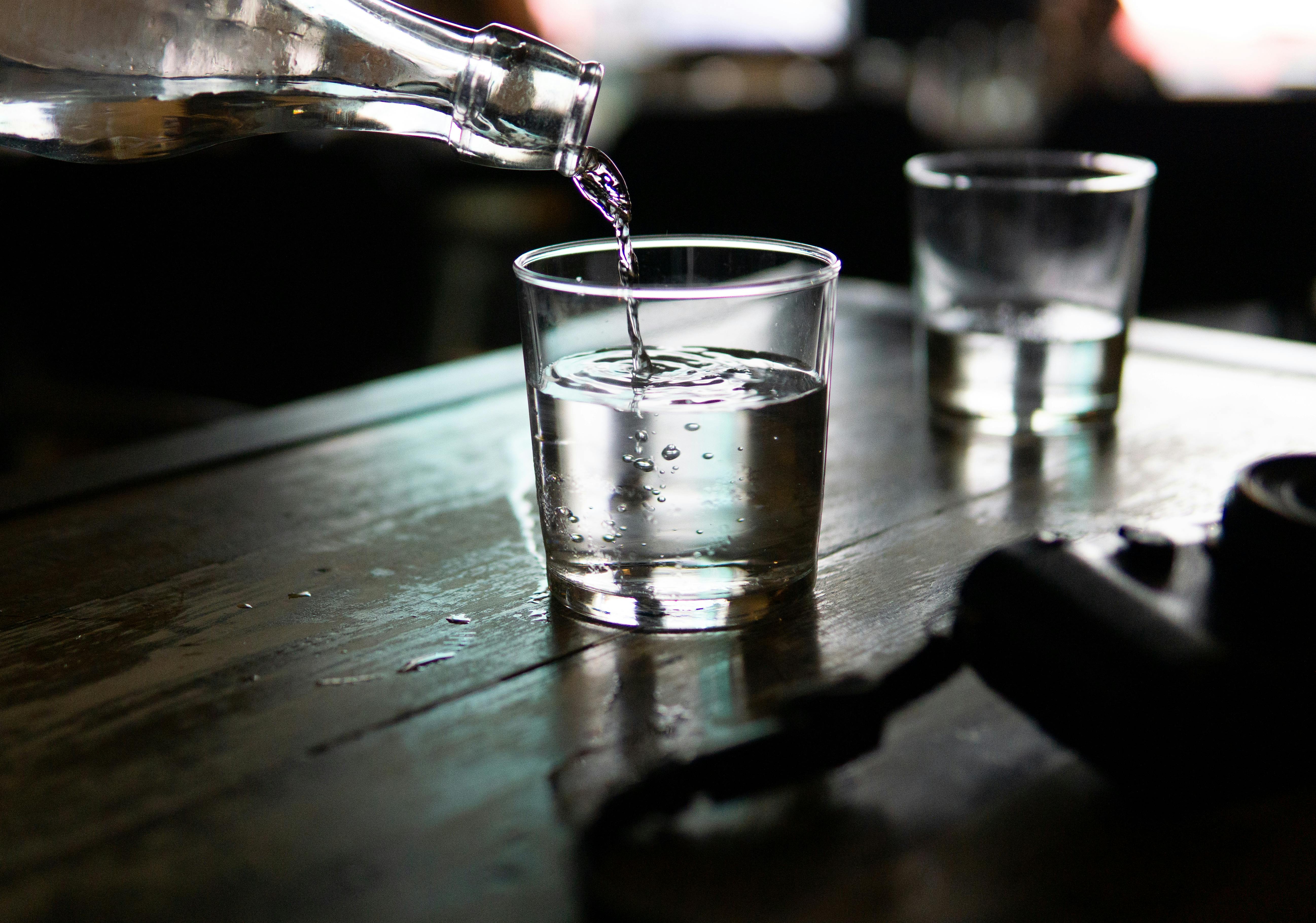 Water being poured into a drinking glass.
