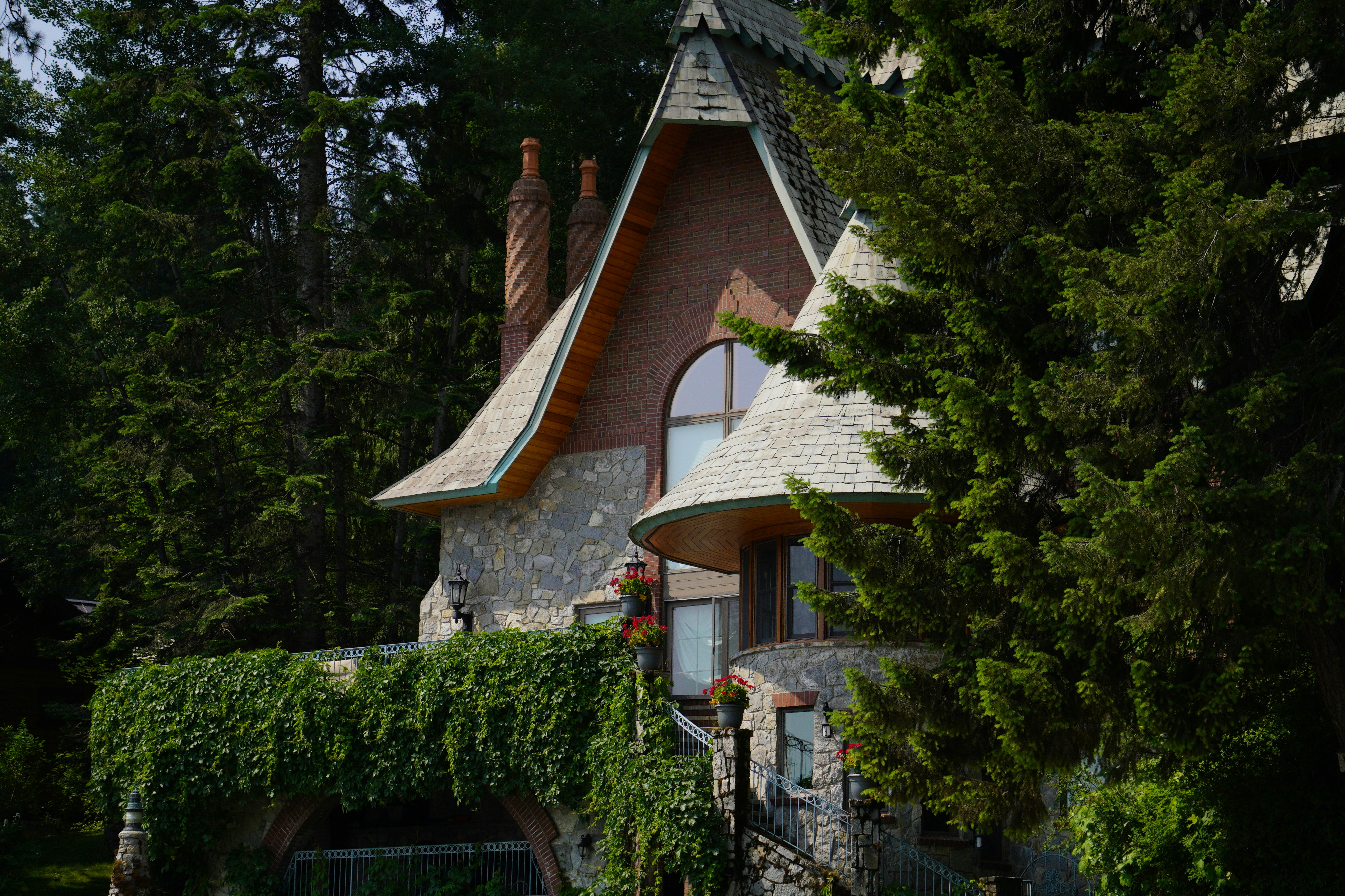 A home set within a wooded landscape.